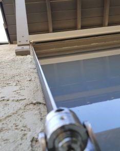 Detail shot showing secure mount and cable system for motorized shades installed by Window Shutters Los Angeles in South Pasadena
